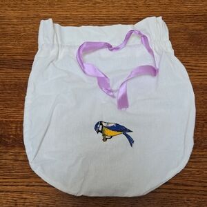White Bag with Embroidered Bird and Lavender Ribbon